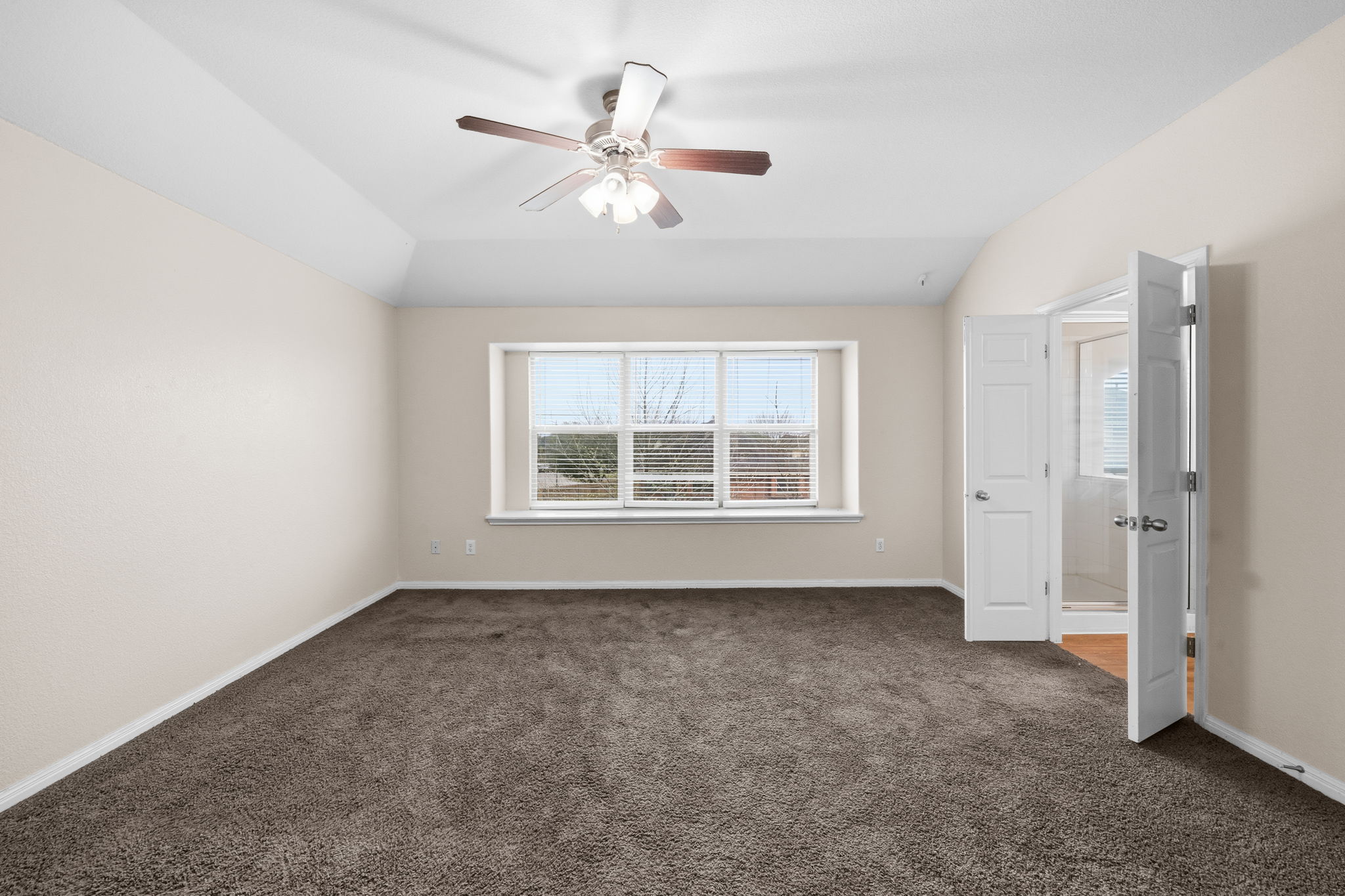 601 Silver Wing Drive Austin, TX 78725 - Photo 11 of 15 a view of an empty room with a window