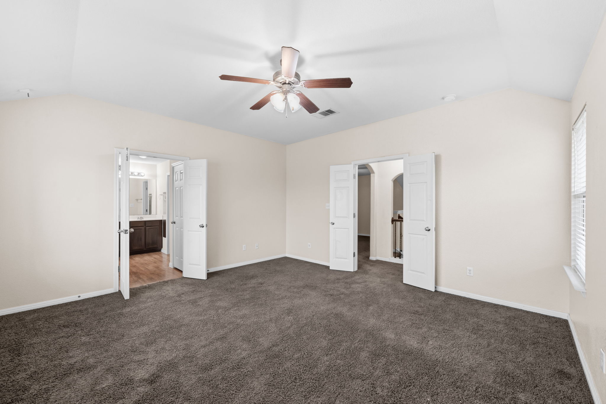 601 Silver Wing Drive Austin, TX 78725 - Photo 12 of 15 a view of an empty room with a ceiling fan