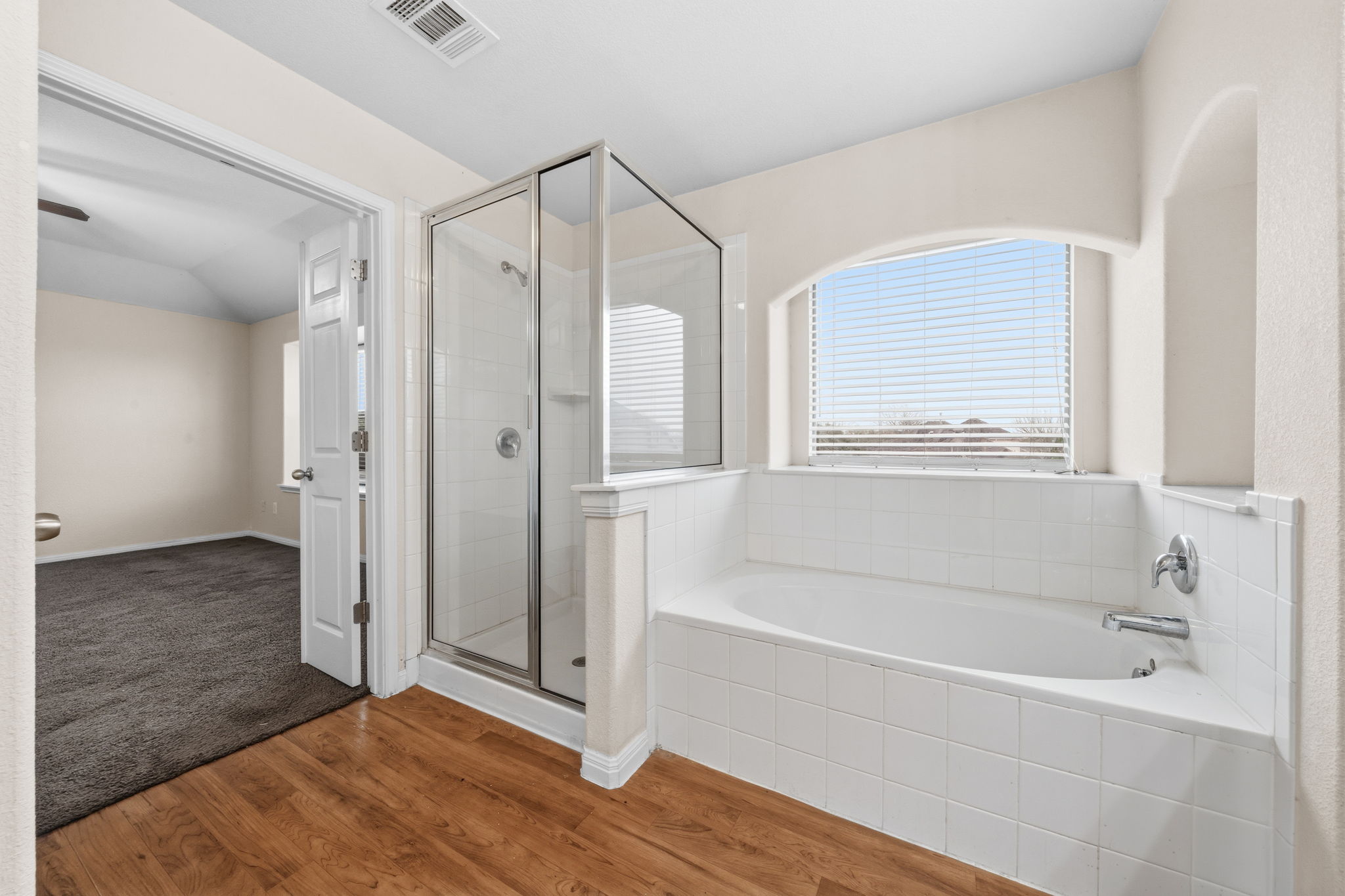 601 Silver Wing Drive Austin, TX 78725 - Photo 14 of 15 a bathroom with a bathtub and a shower