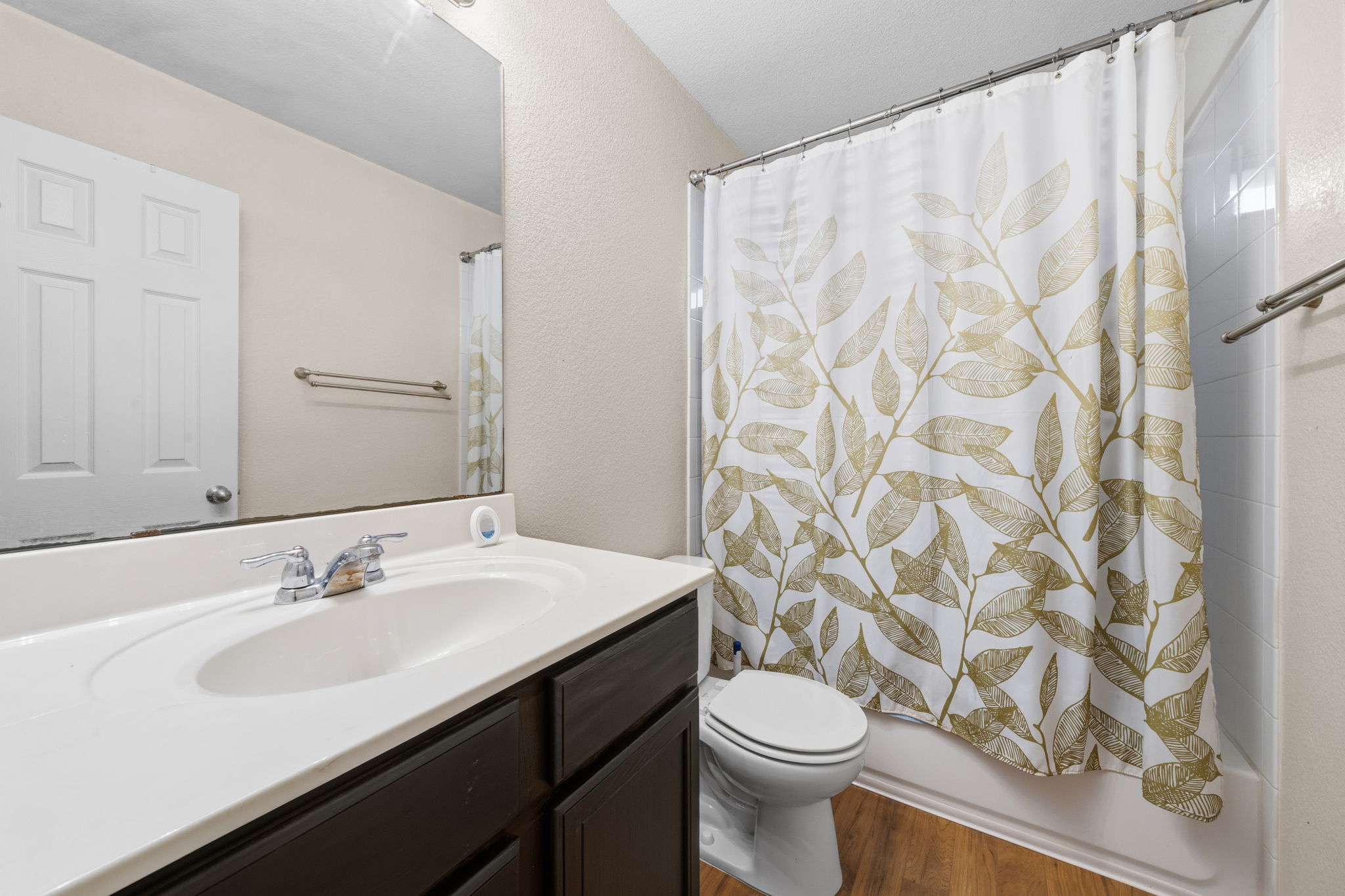 601 Silver Wing Drive Austin, TX 78725 - Photo 9 of 15 a bathroom with a sink and a mirror