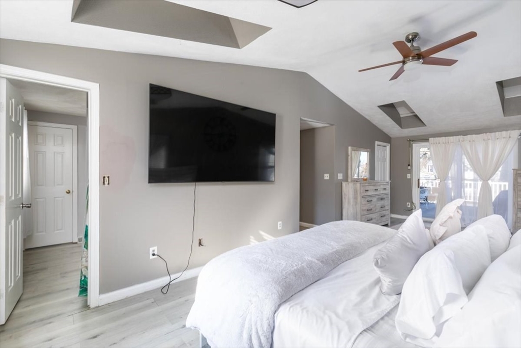 11 Andover Street Danvers, MA 01923 - Photo 23 of 41 a bedroom with a bed and a flat screen tv