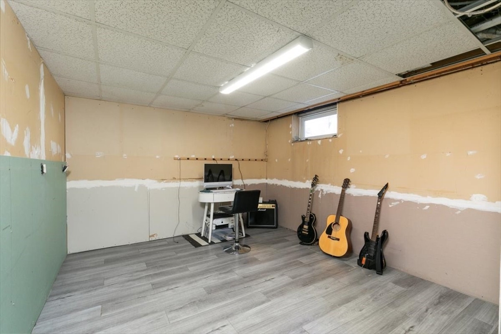 11 Andover Street Danvers, MA 01923 - Photo 31 of 41 a view of a room with wooden floor and furniture