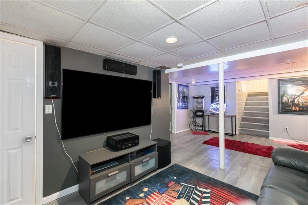 11 Andover Street Danvers, MA 01923 - Photo 33 of 41 a living room with furniture and a flat screen tv