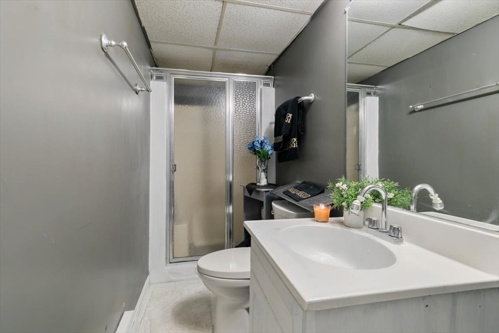 11 Andover Street Danvers, MA 01923 - Photo 34 of 41 a bathroom with a sink toilet and shower