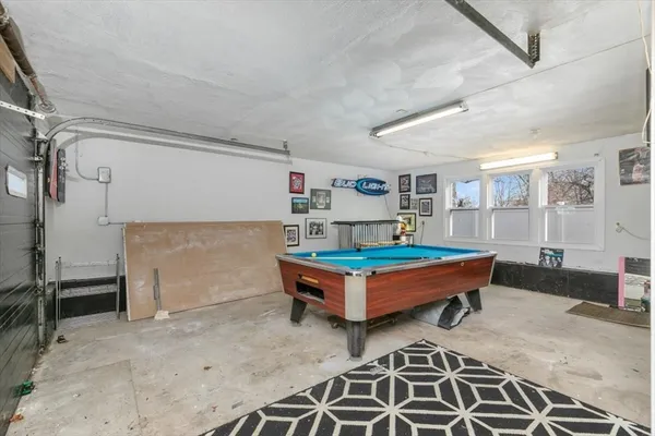 a room with pool table and flat screen tv