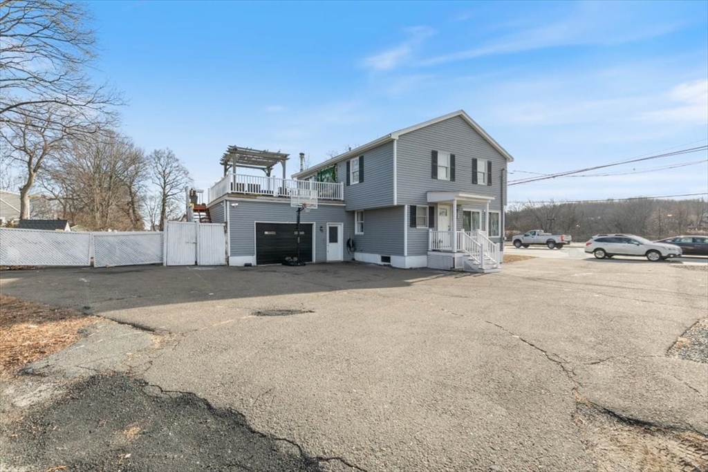 11 Andover Street Danvers, MA 01923 - Photo 5 of 41 a view of a house with a snow in the yard