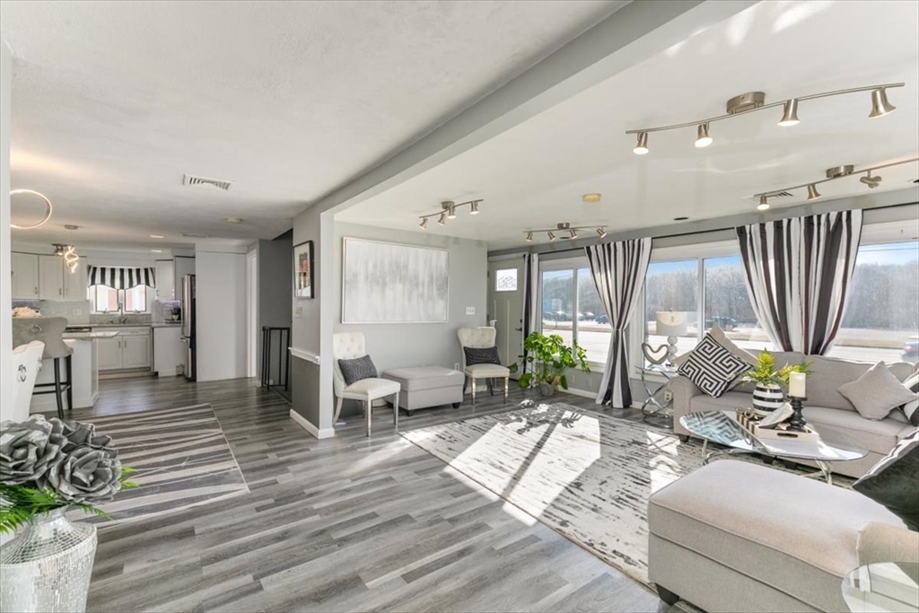 11 Andover Street Danvers, MA 01923 - Photo 7 of 41 a living room with furniture large window and wooden floor