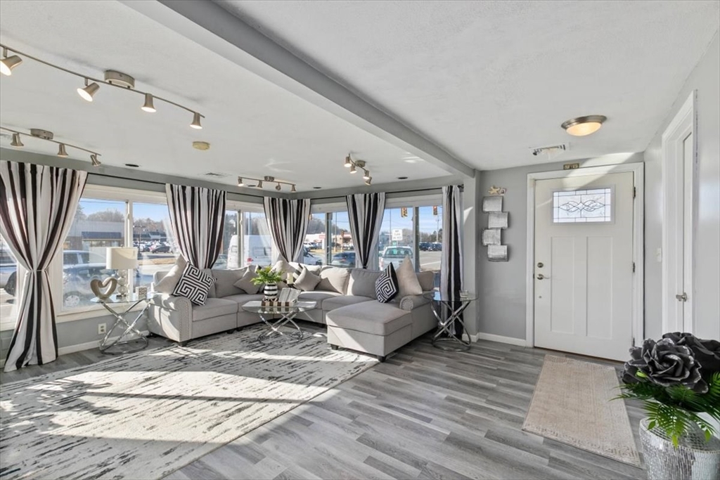 11 Andover Street Danvers, MA 01923 - Photo 8 of 41 a living room with furniture and wooden floor