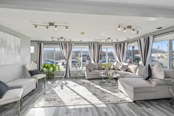 a living room with furniture and a large window