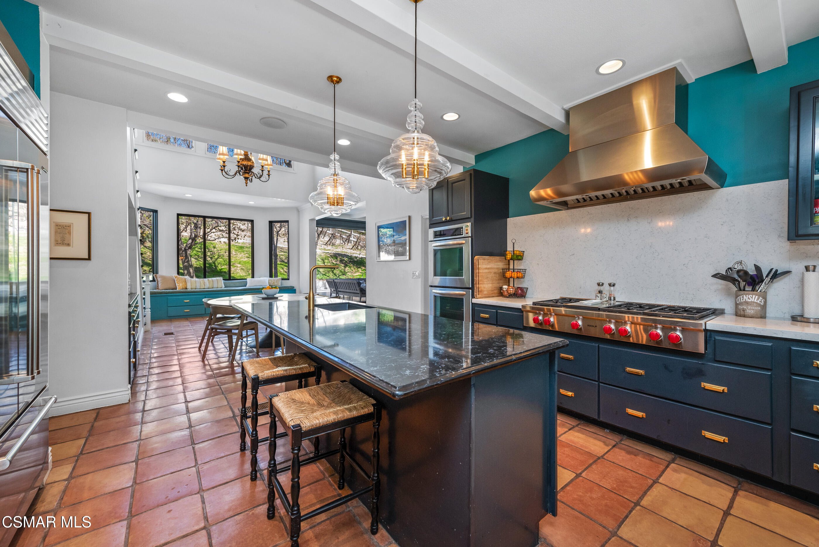 6144 Chesebro Road Agoura Hills, CA 91301 - Photo 20 of 73 a kitchen with stainless steel appliances granite countertop a sink a stove and a wooden floors