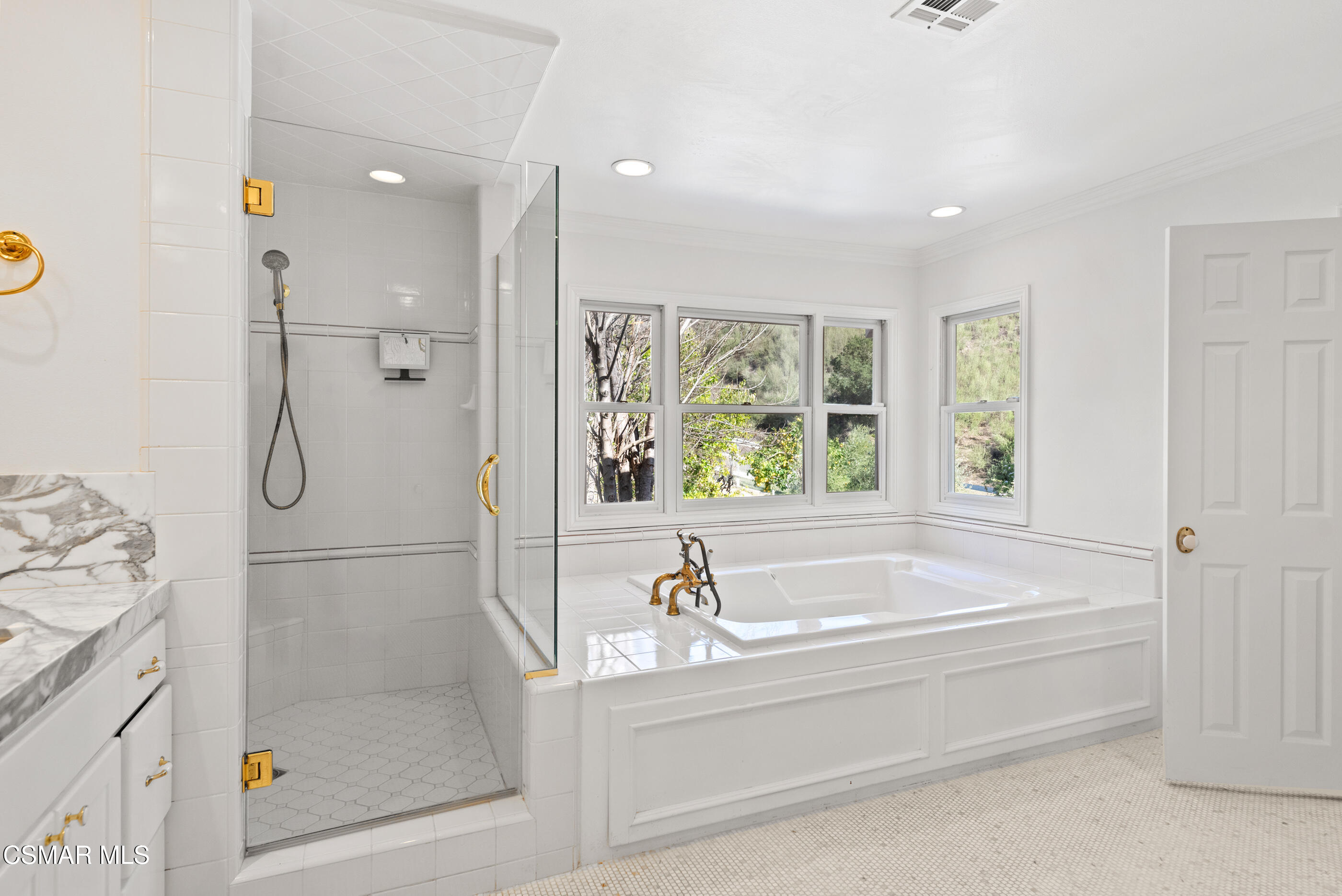 6144 Chesebro Road Agoura Hills, CA 91301 - Photo 31 of 73 a bathroom with a bathtub and a shower
