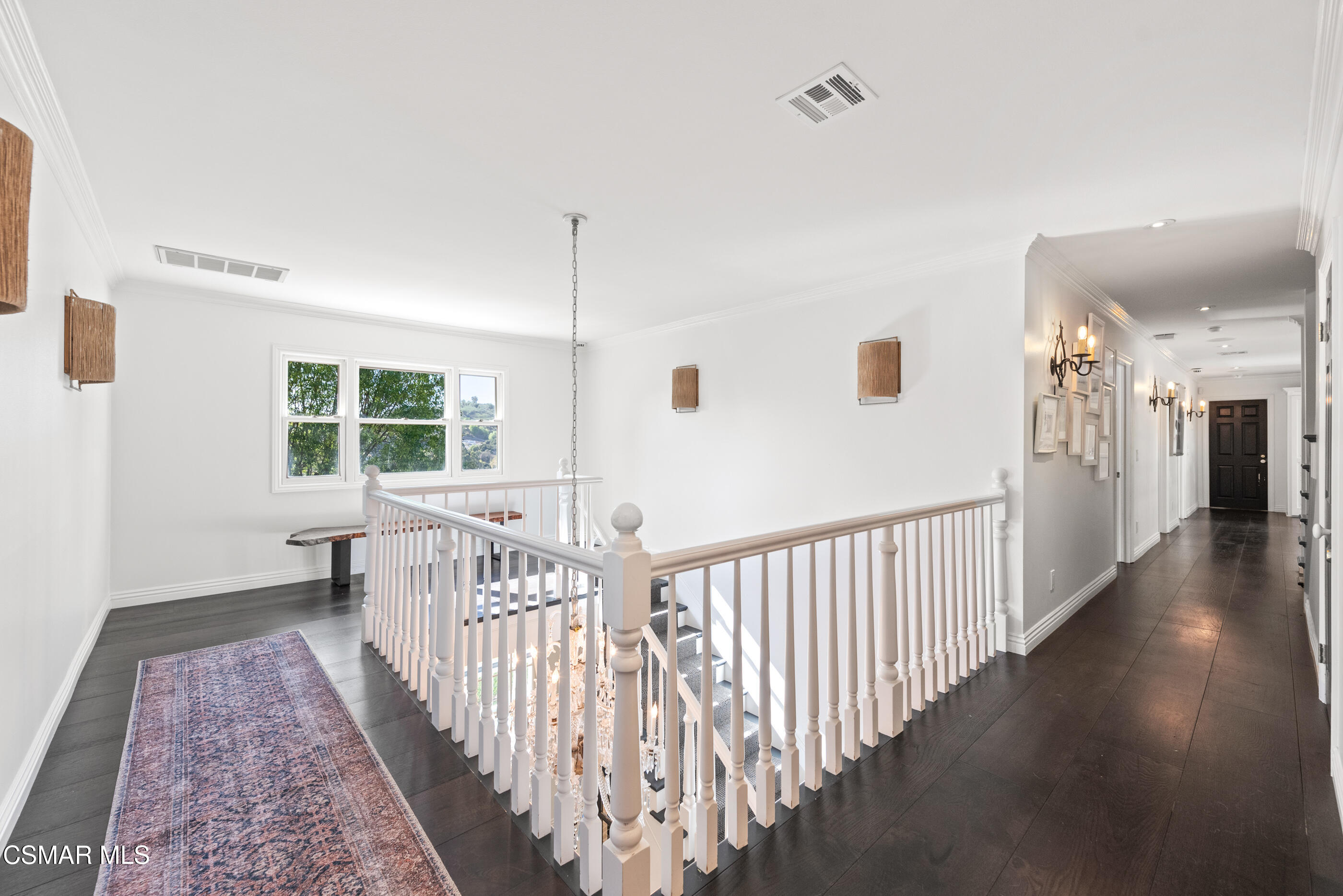 6144 Chesebro Road Agoura Hills, CA 91301 - Photo 34 of 73 a view of a hallway with wooden floor and windows