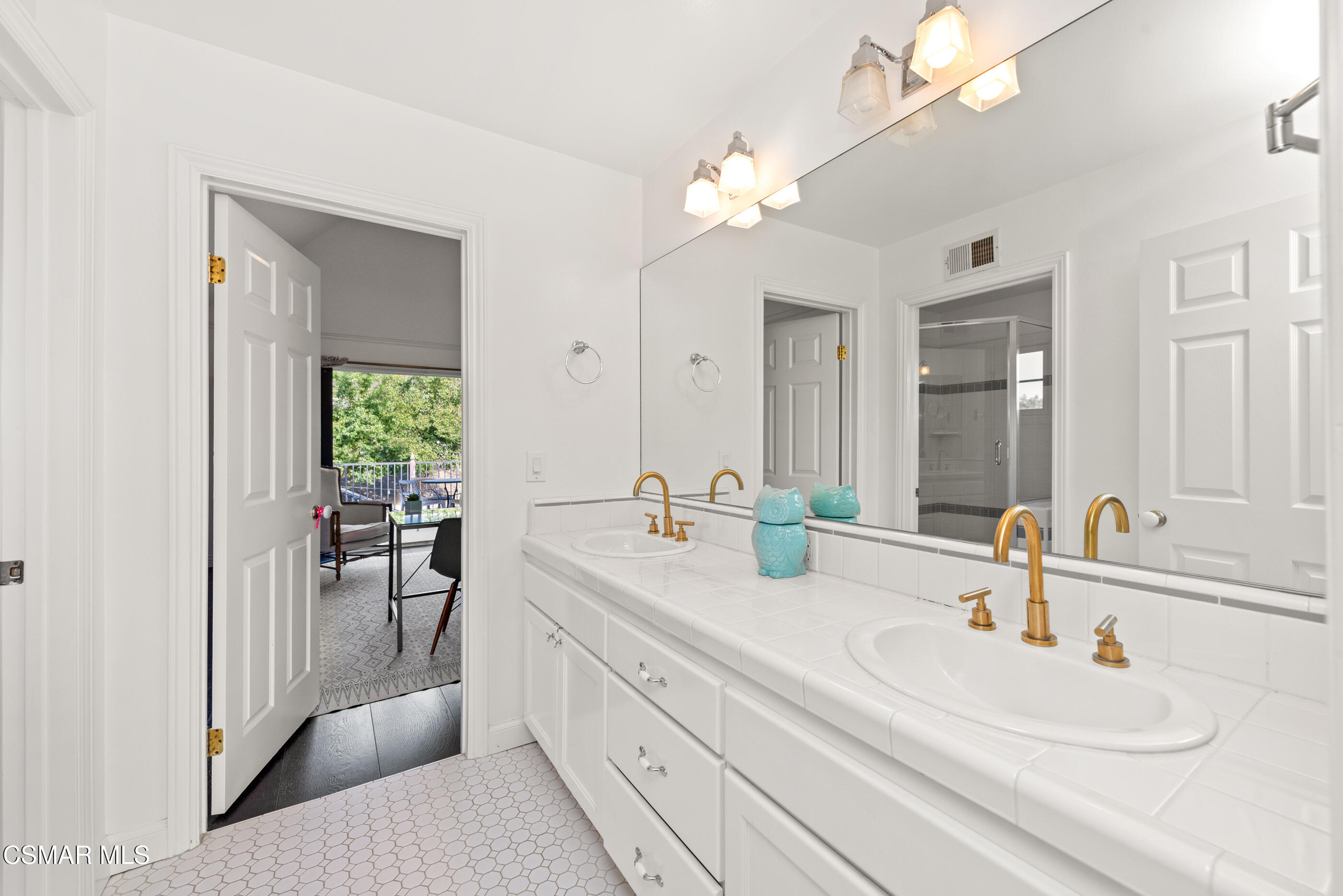 6144 Chesebro Road Agoura Hills, CA 91301 - Photo 36 of 73 a bathroom with a sink double vanity and a mirror
