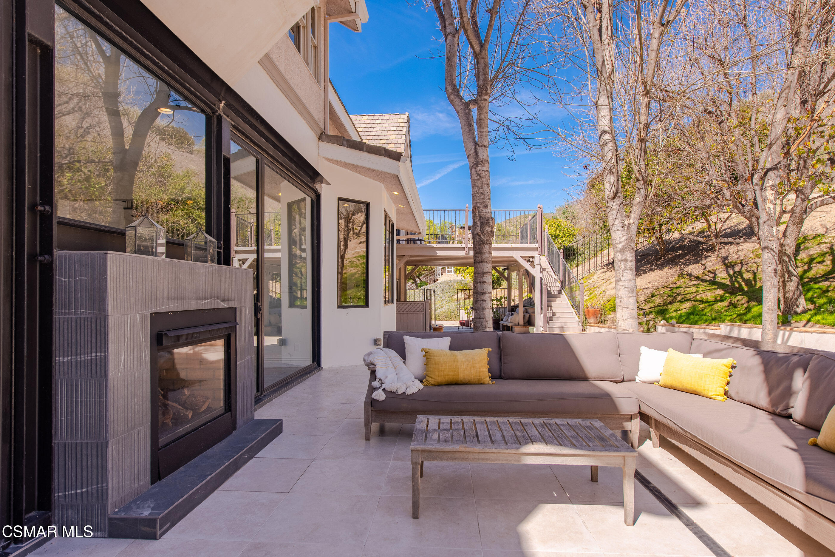 6144 Chesebro Road Agoura Hills, CA 91301 - Photo 49 of 73 a outdoor living space with patio furniture and a fireplace