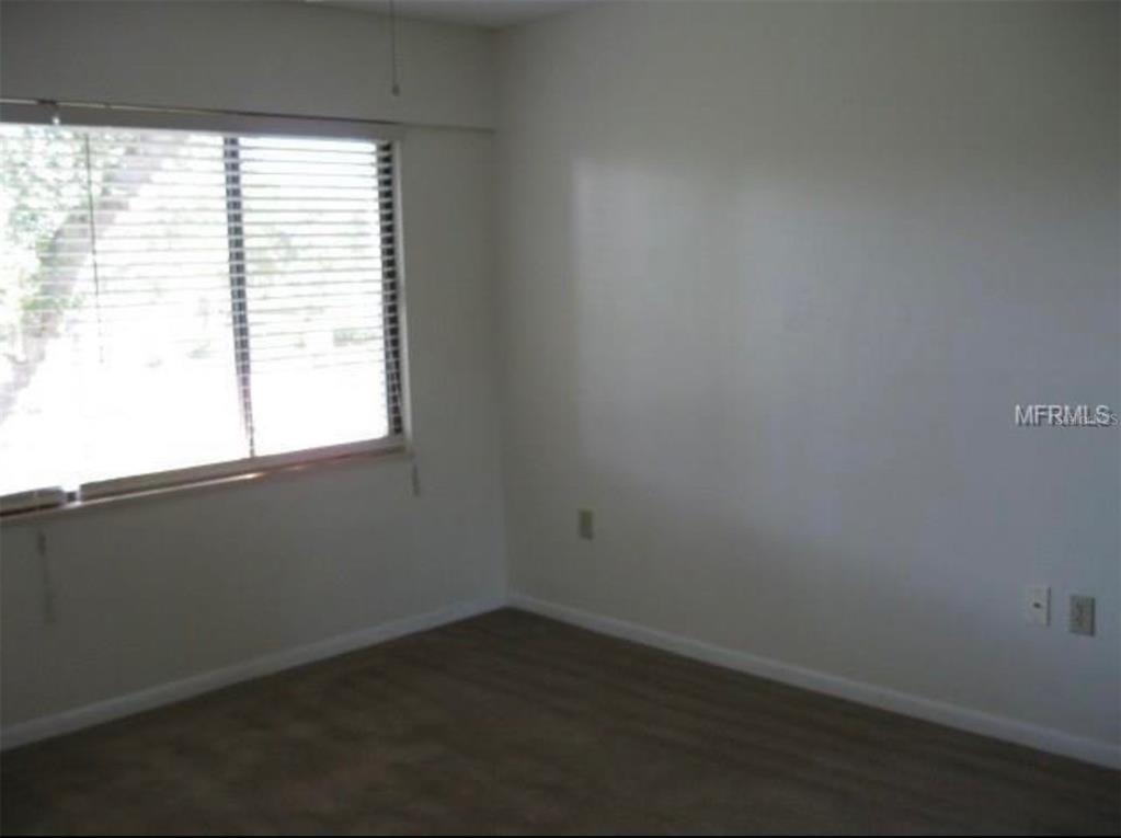 11450 Harbor Way, Unit 5002 Largo, FL 33774 - Photo 15 of 25 an empty room with a window