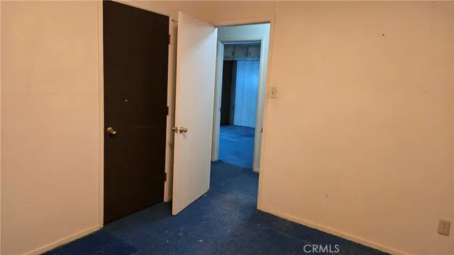 an empty room with wooden floor