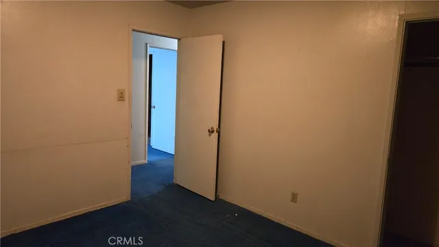 an empty room with wooden floor