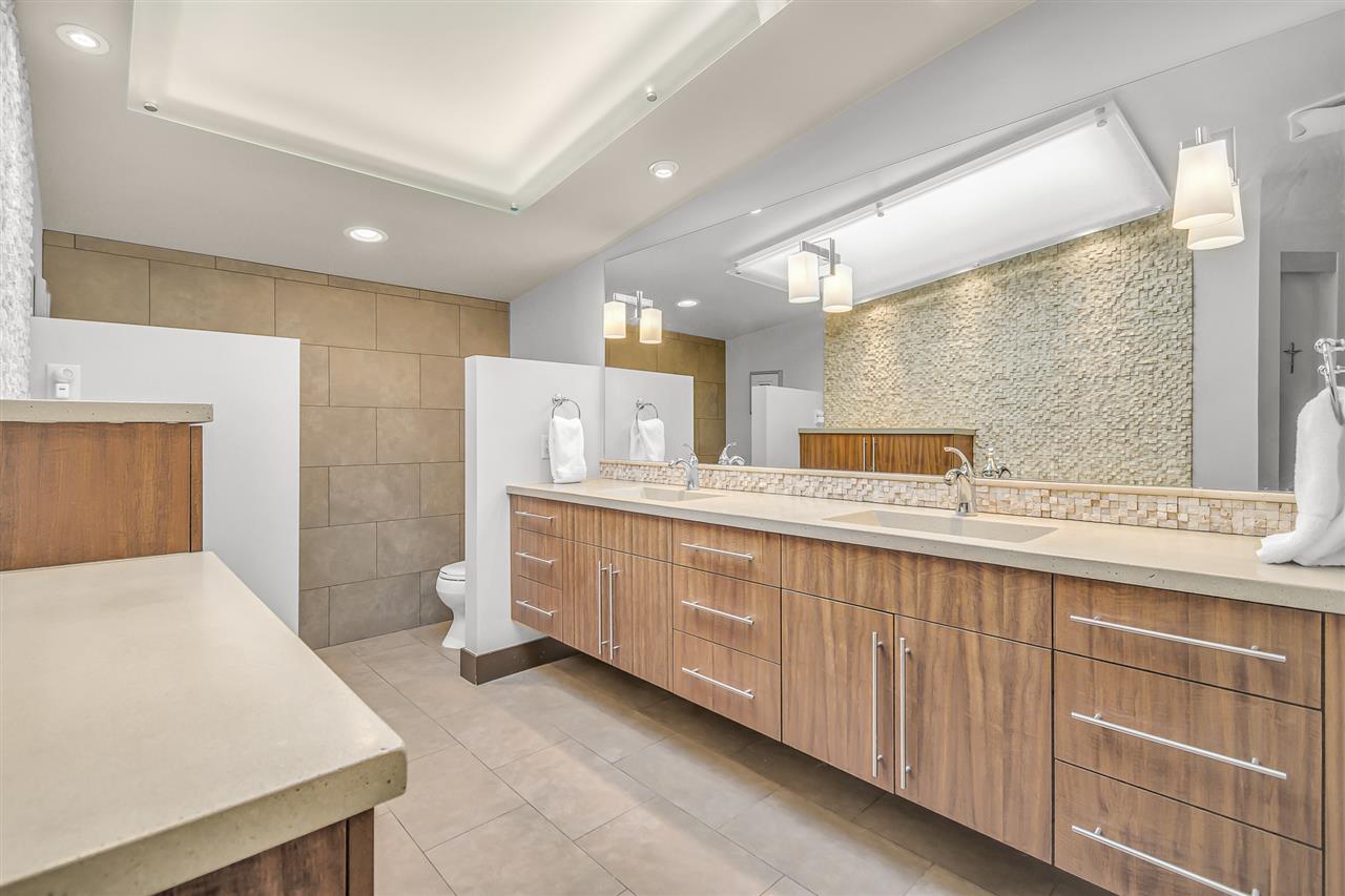 702 Golfmore Drive, Unit C Grand Junction, CO 81506 - Photo 12 of 21 a spacious bathroom with a double vanity sink and a mirror