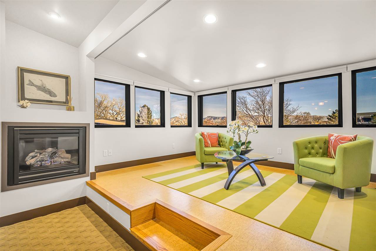 702 Golfmore Drive, Unit C Grand Junction, CO 81506 - Photo 15 of 21 a living room with furniture and a wall painting
