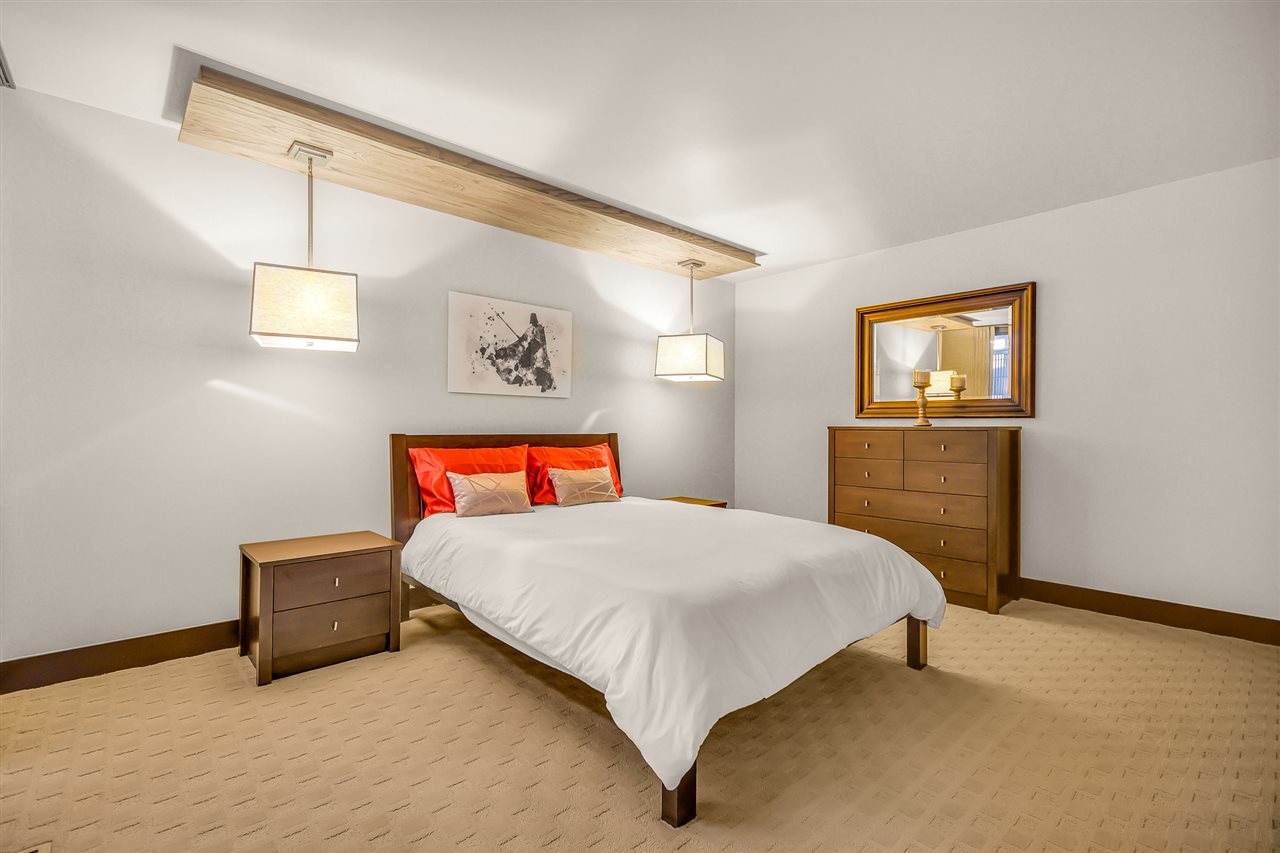 702 Golfmore Drive, Unit C Grand Junction, CO 81506 - Photo 17 of 21 a bedroom with a bed and a cabinets