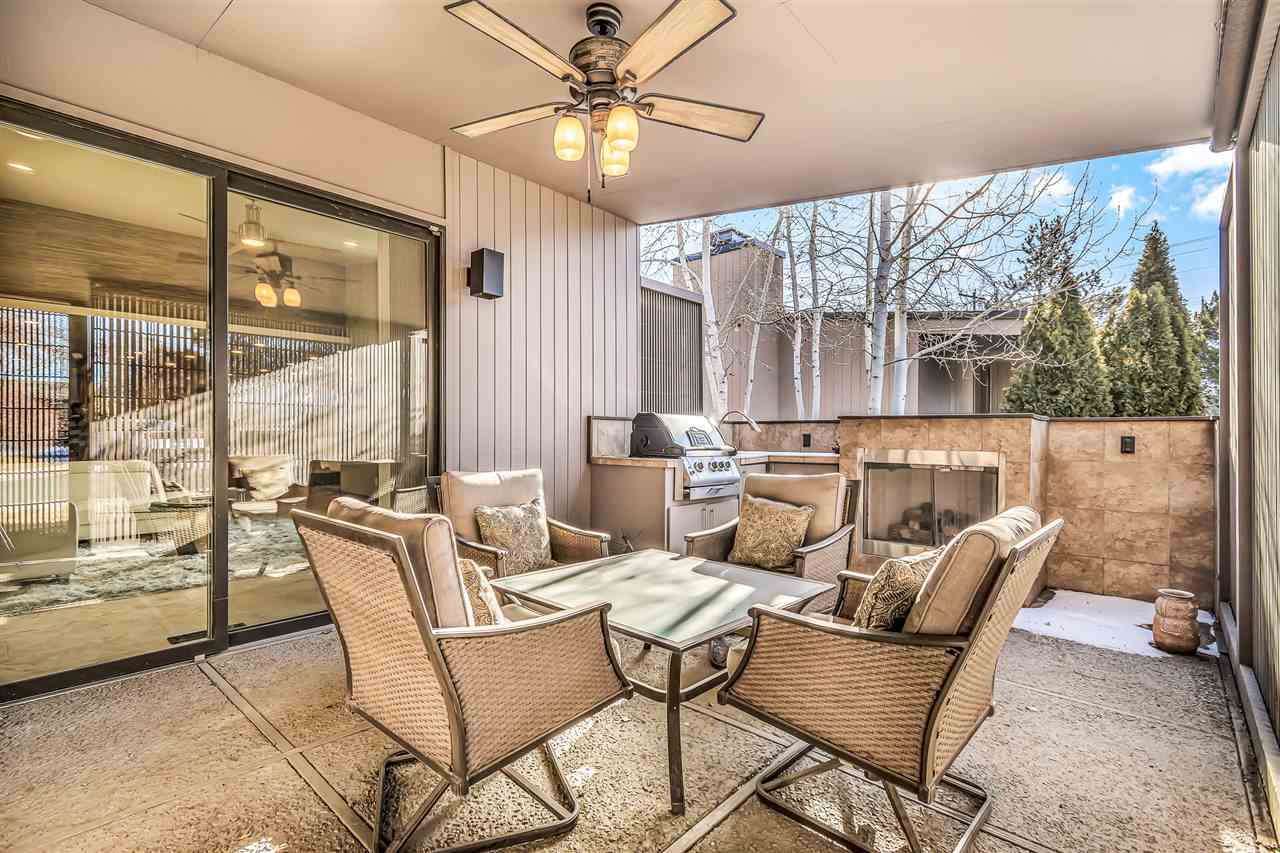 702 Golfmore Drive, Unit C Grand Junction, CO 81506 - Photo 21 of 21 a dining room with furniture and large windows