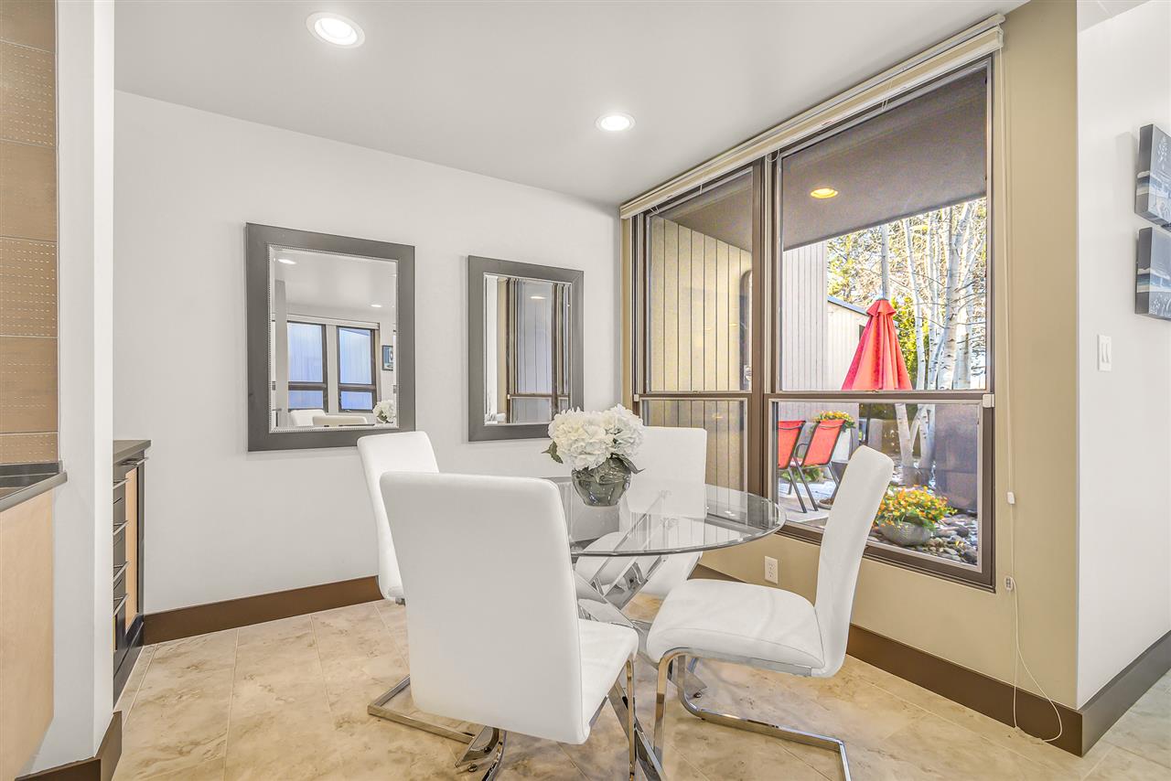 702 Golfmore Drive, Unit C Grand Junction, CO 81506 - Photo 7 of 21 a view of a dining room with furniture window and outside view