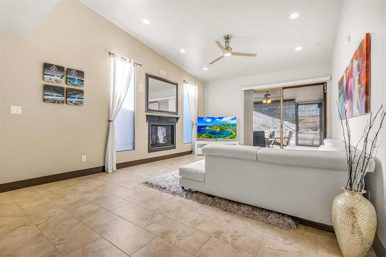 702 Golfmore Drive, Unit C Grand Junction, CO 81506 - Photo 8 of 21 a living room with furniture and a fireplace