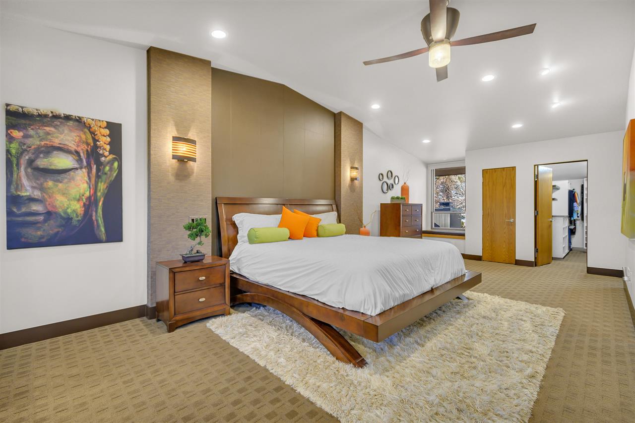 702 Golfmore Drive, Unit C Grand Junction, CO 81506 - Photo 9 of 21 a bed room with a bed and a painting