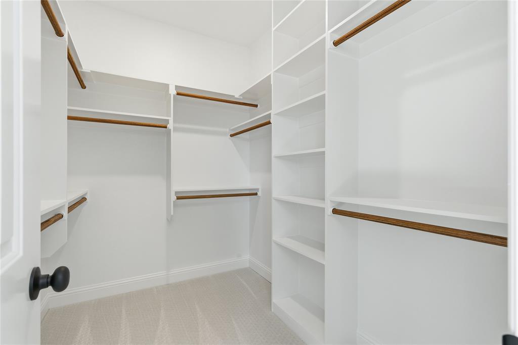420 Ball Street Tom Bean, TX 75491 - Photo 19 of 34 a view of walk in closet with empty racks