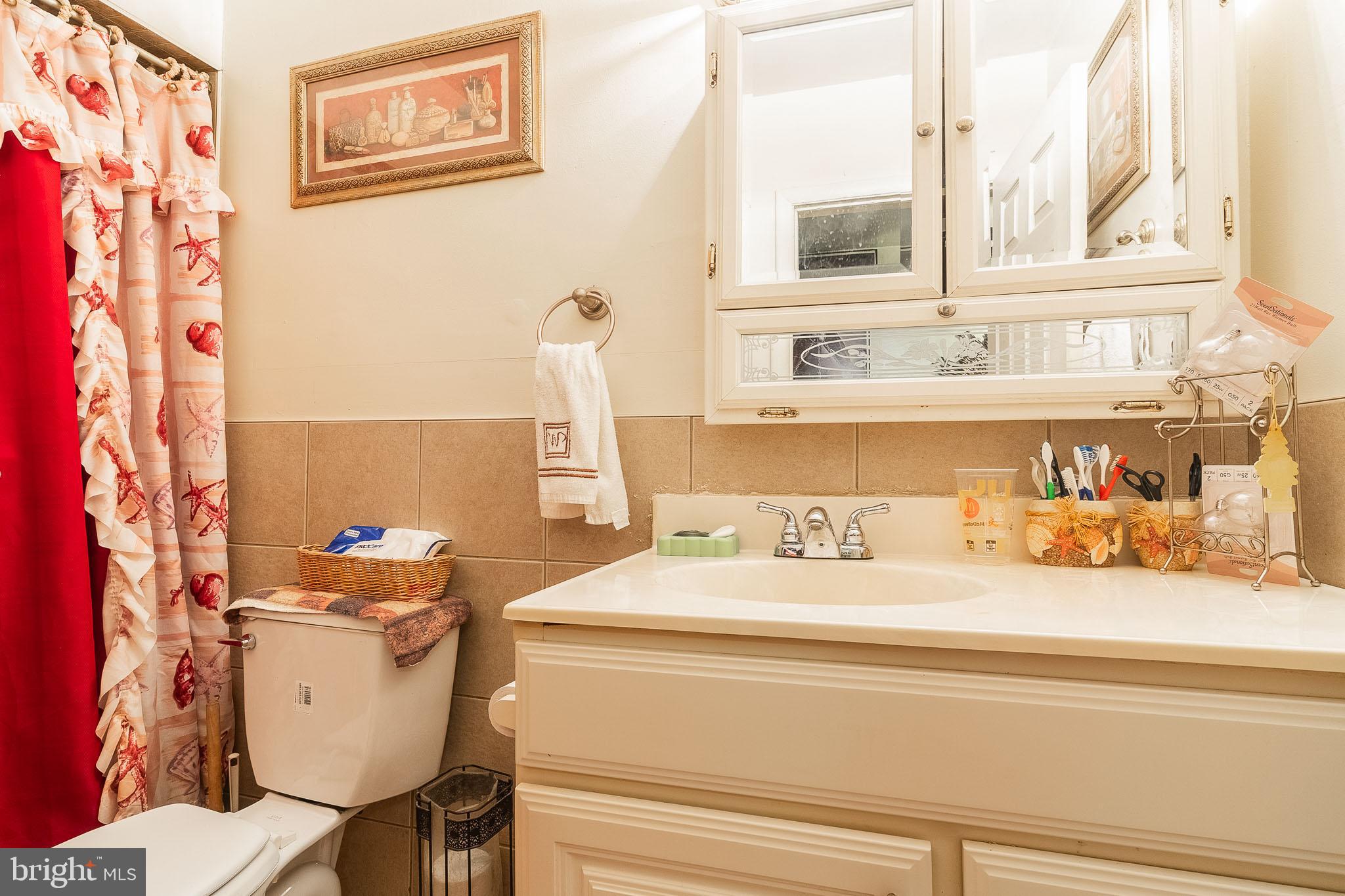 2715 East Madison Street Baltimore, MD 21205 - Photo 7 of 11 a bathroom with a sink and a toilet