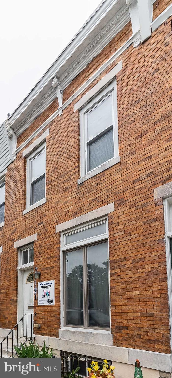 2715 East Madison Street Baltimore, MD 21205 - Photo 10 of 11 a building with a door