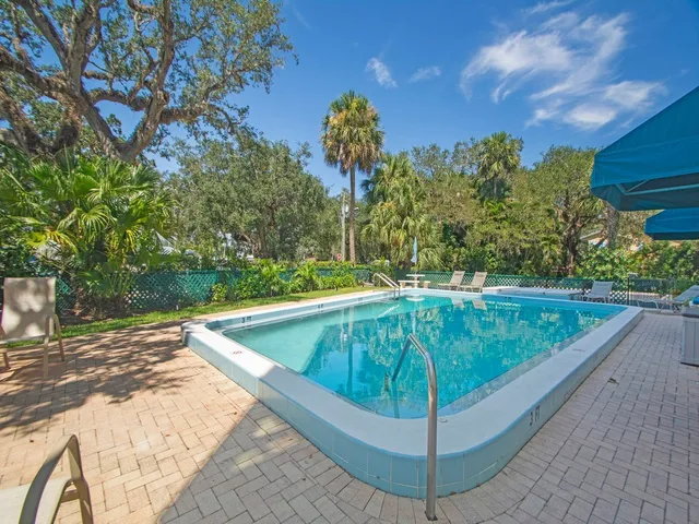 a view of a backyard with chairs