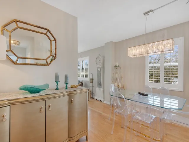 a room with a window and chandelier