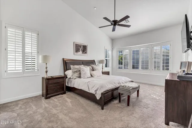 a bedroom with a bed and a bookshelf