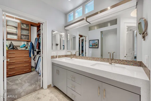 a bathroom with a sink toilet vanity and shower