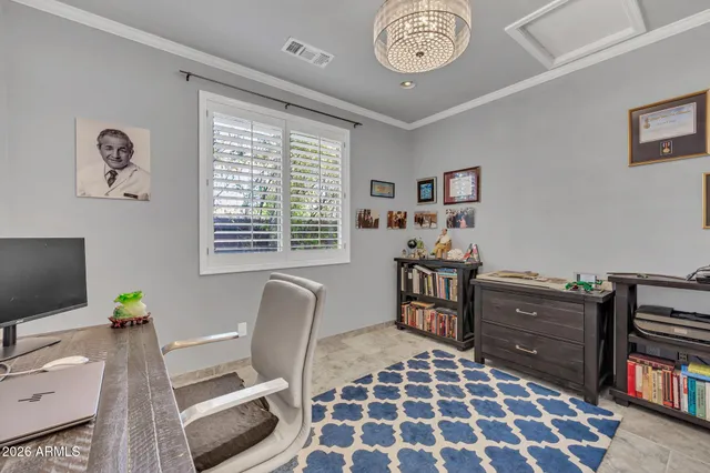 a view of a livingroom with furniture and a window