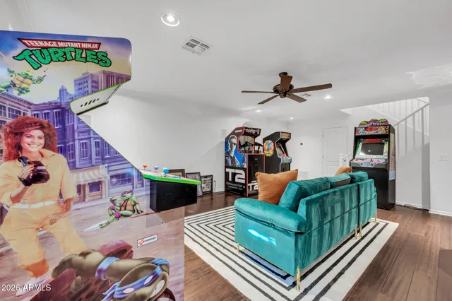 a living room with furniture and a floor to ceiling window