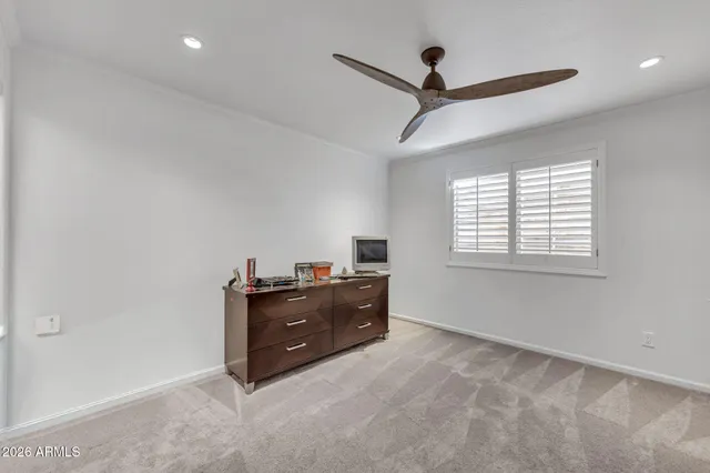 a view of a backyard with swimming pool
