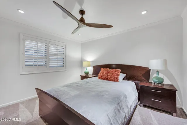 a view of a patio with table and chairs with wooden floor and fence