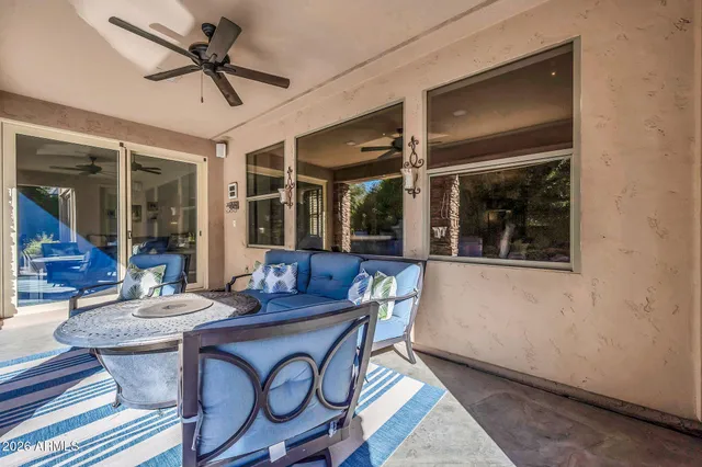 an aerial view of a house with a yard and a swimming pool