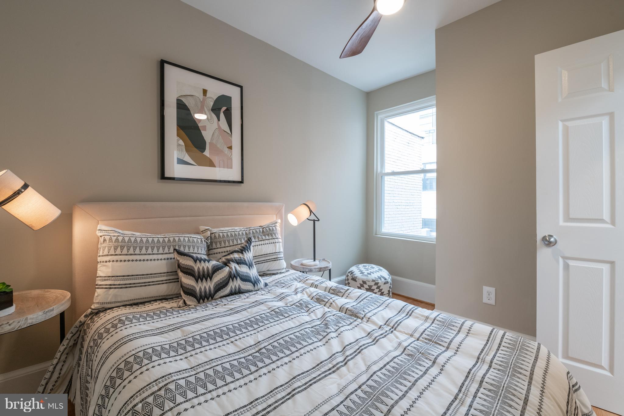 1327 V Street Northwest Washington, DC 20009 - Photo 17 of 29 a bedroom with a bed and a window