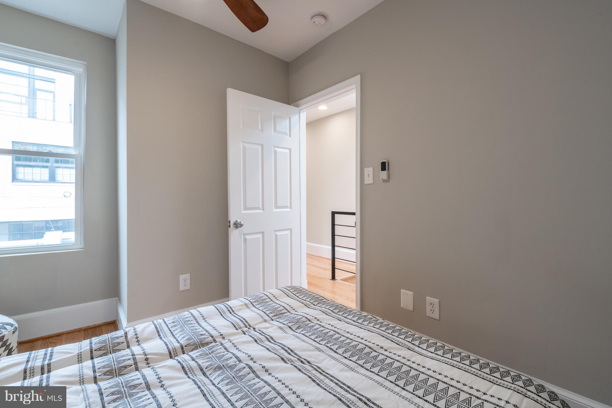 1327 V Street Northwest Washington, DC 20009 - Photo 18 of 29 a view of a room with wooden floor and windows