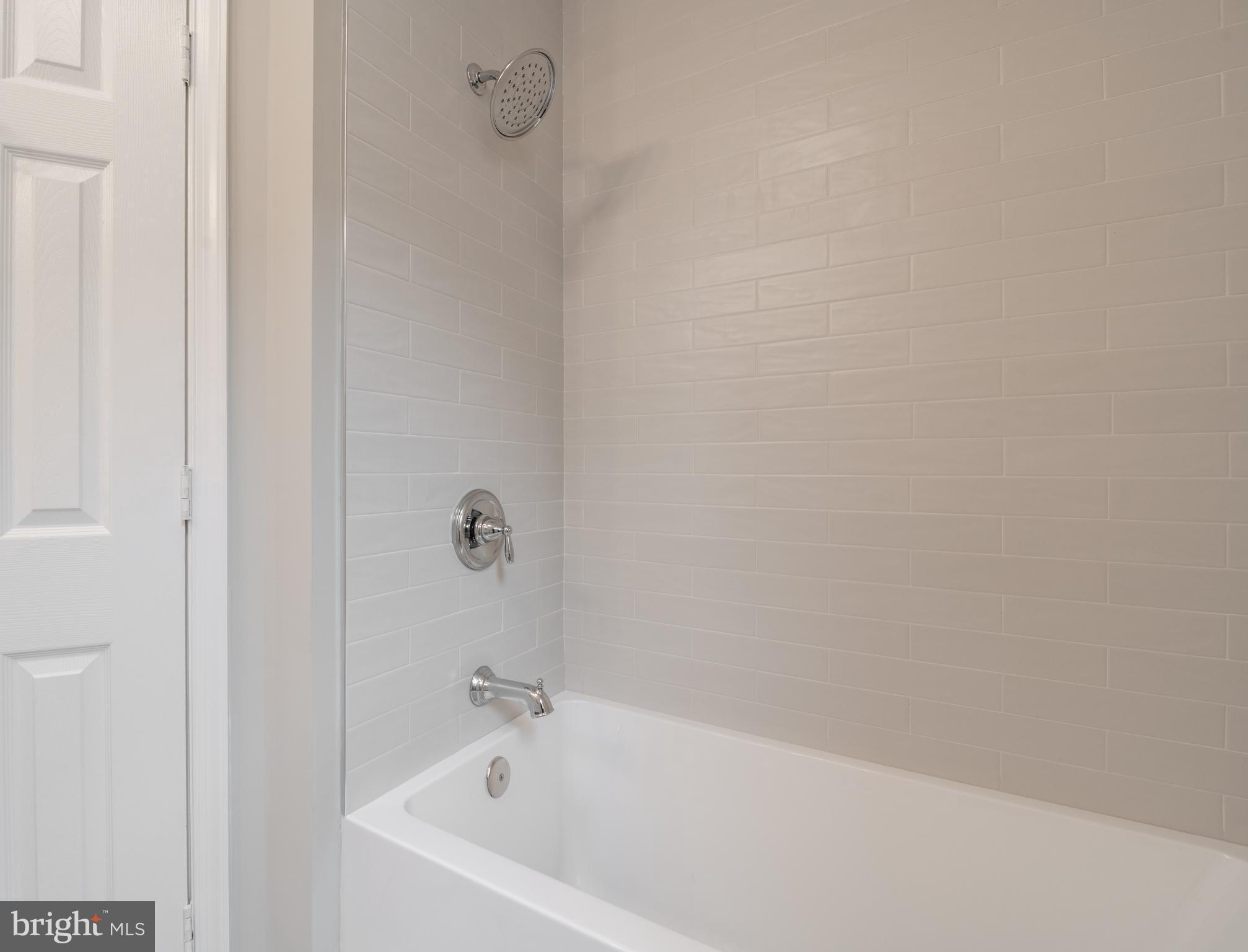 1327 V Street Northwest Washington, DC 20009 - Photo 22 of 29 a white bath tub sitting next to a white wall