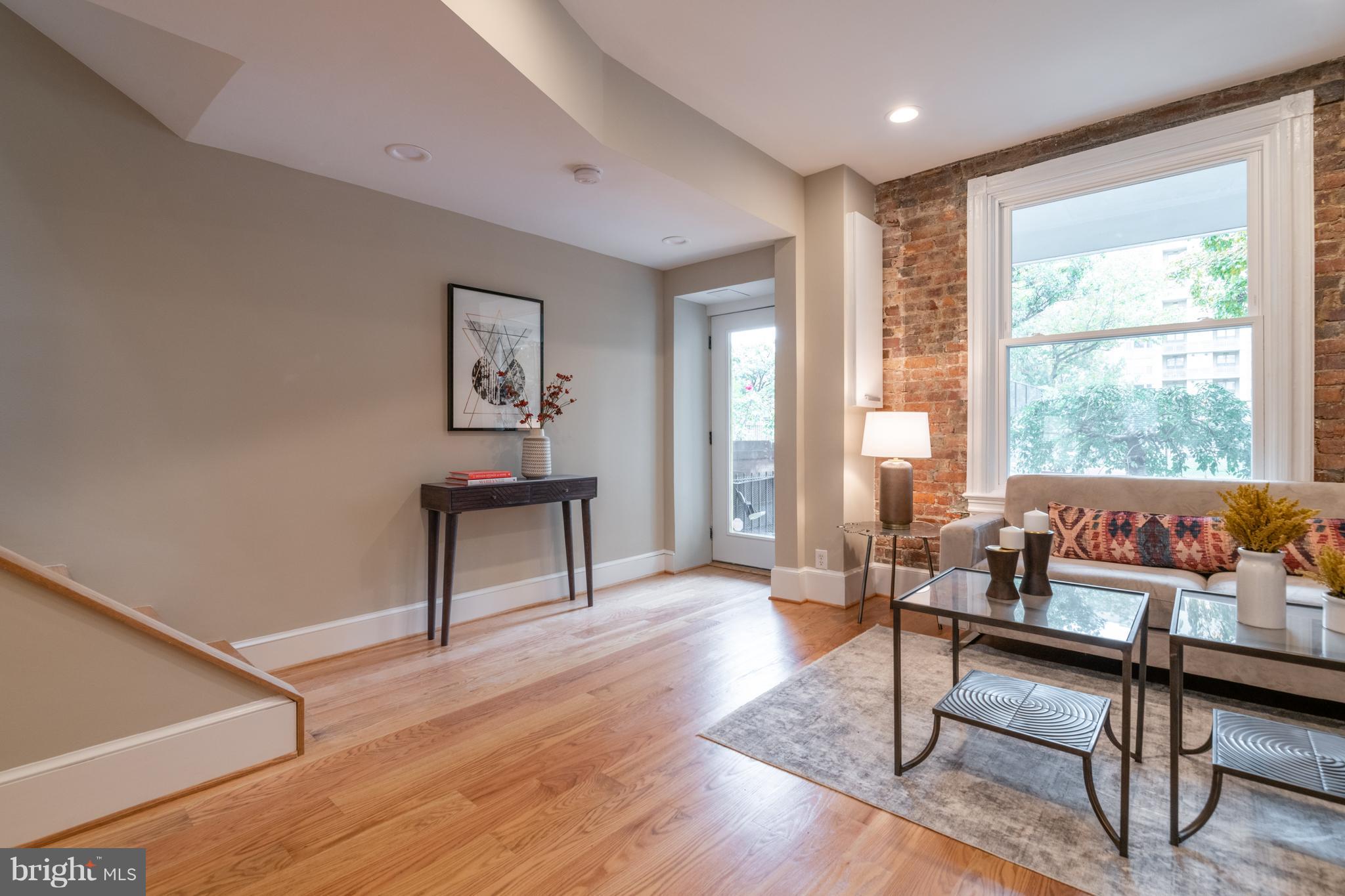 1327 V Street Northwest Washington, DC 20009 - Photo 4 of 29 a living room with furniture and a window