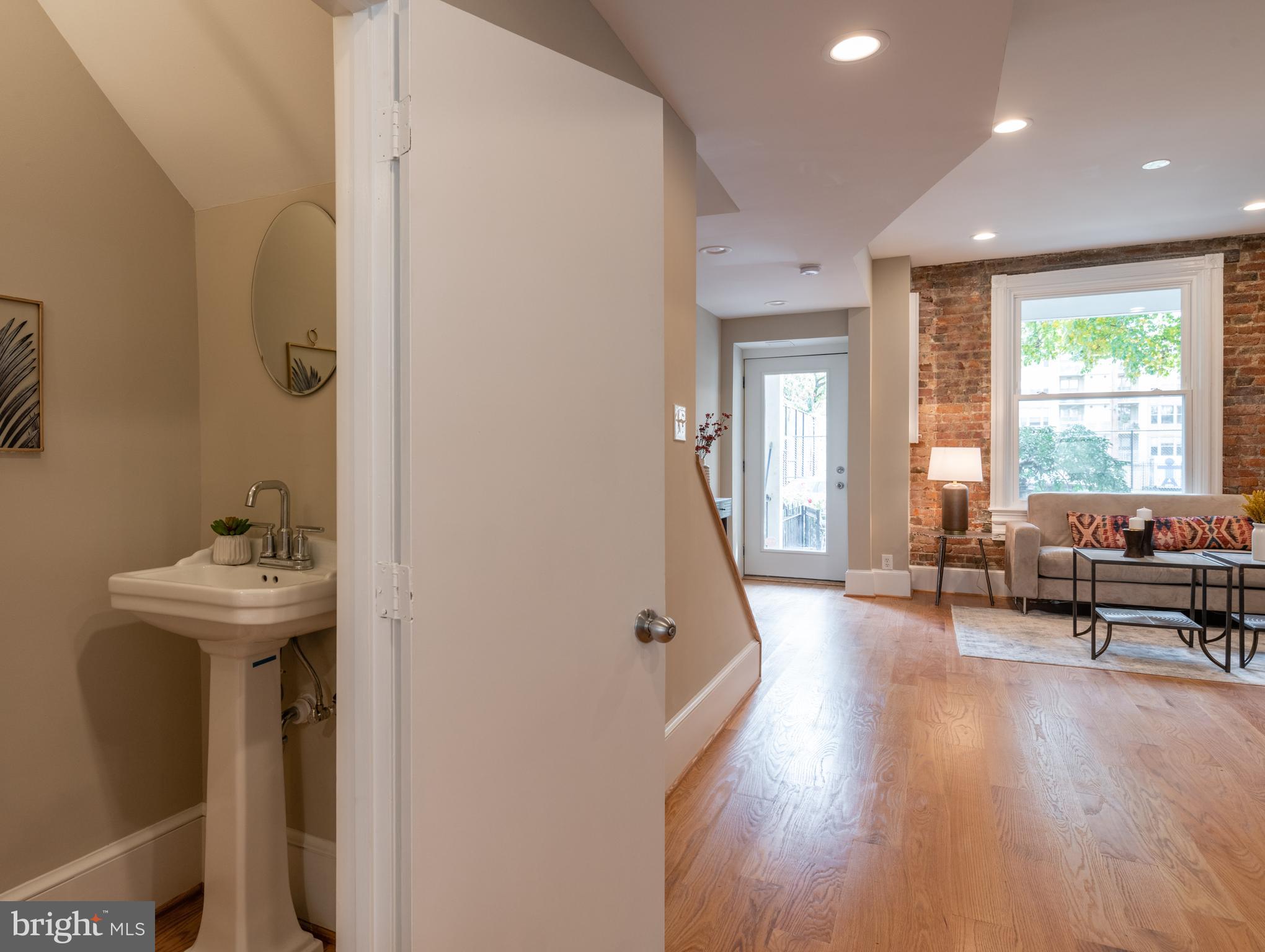1327 V Street Northwest Washington, DC 20009 - Photo 10 of 29 a living room with furniture and a wooden floor