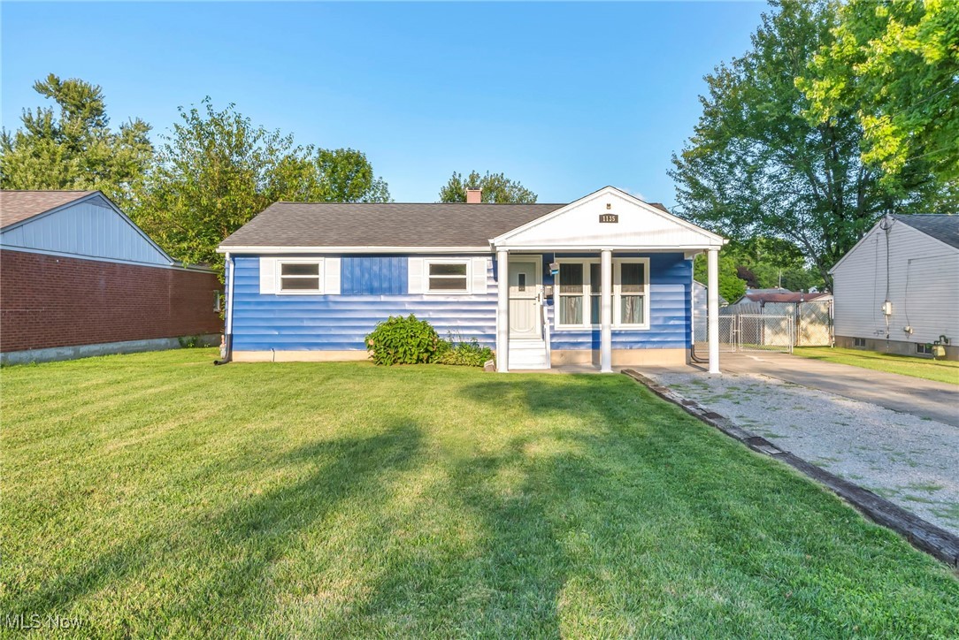 1135 Keefer Road Girard, OH 44420 - Photo 1 of 32 View of front of home with a front lawn, a chimney, and a porch