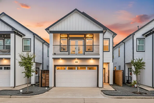 a front view of a house with a garage