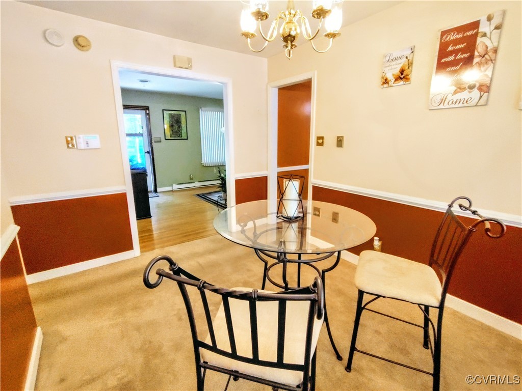 3972 Bridgeton Road Richmond, VA 23234 - Photo 4 of 6 Dining area featuring a notable chandelier, light