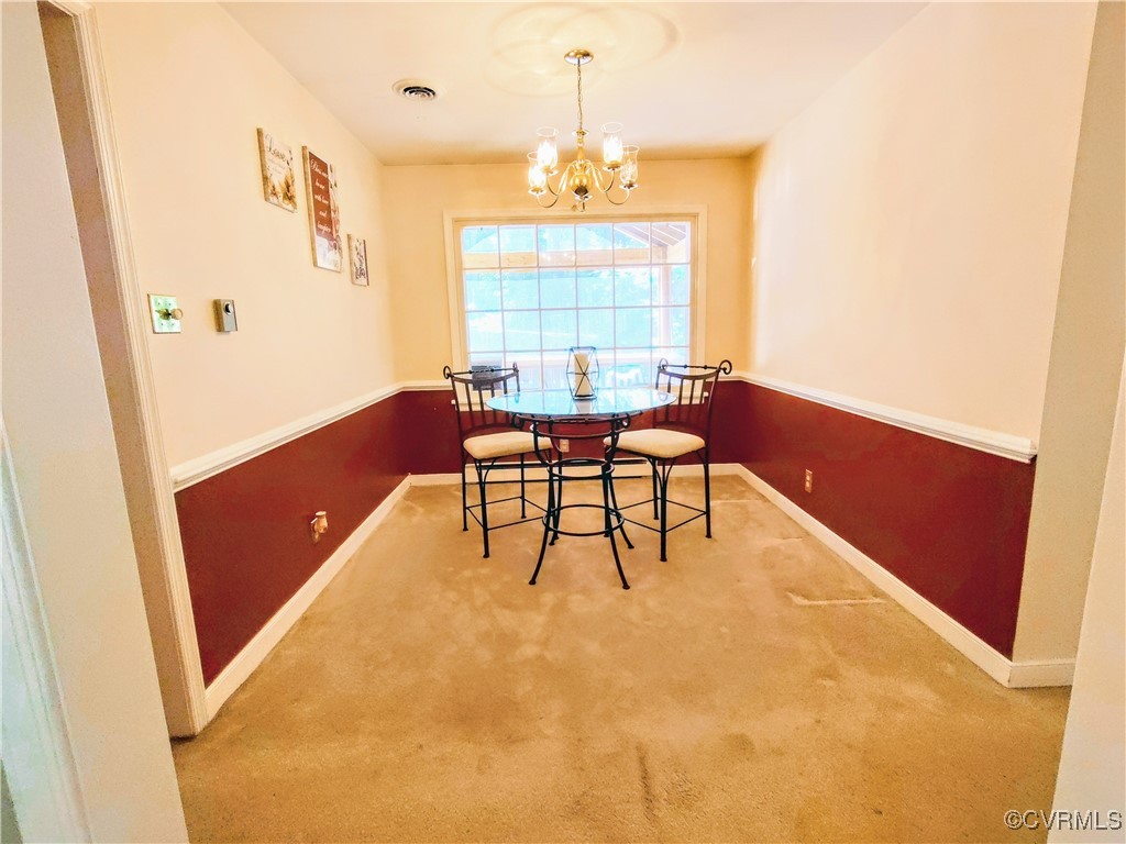 3972 Bridgeton Road Richmond, VA 23234 - Photo 5 of 6 Carpeted dining space with a chandelier