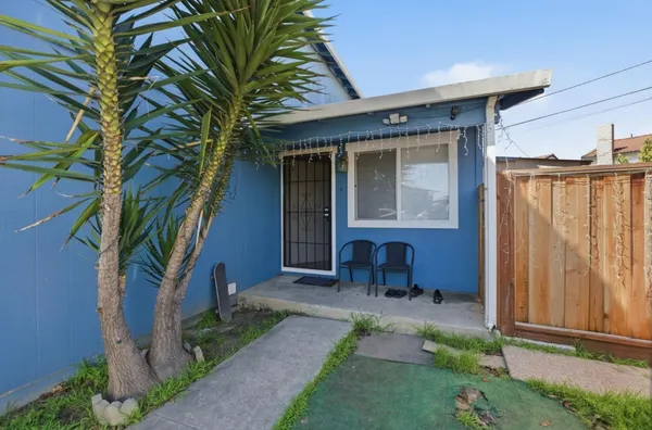 a front view of a house with garden